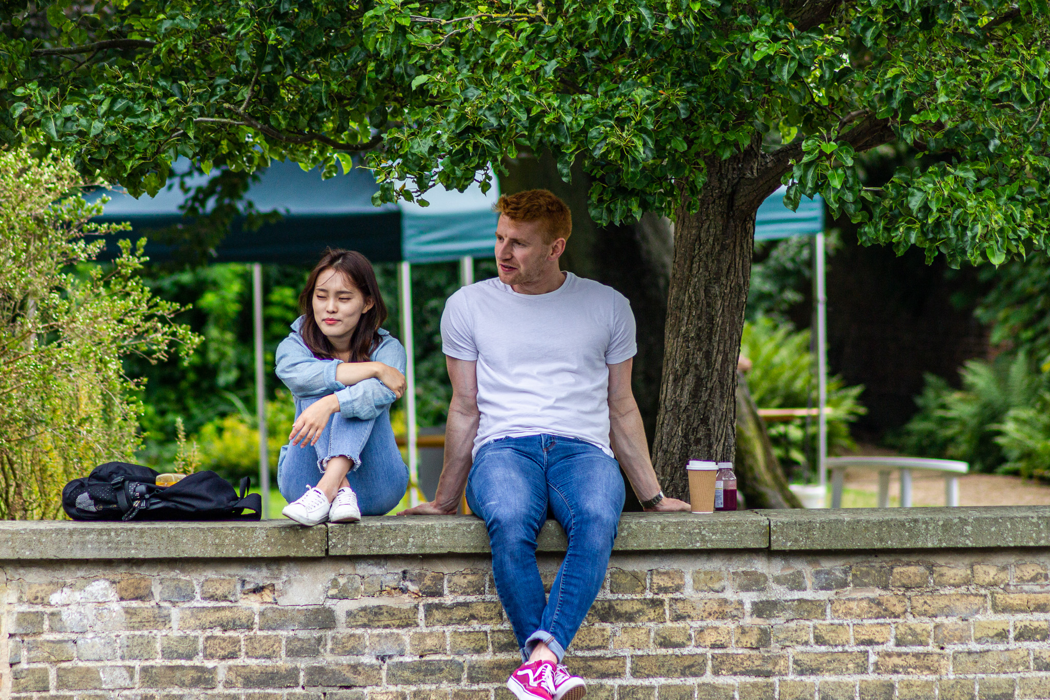 A couple watching the boats go by in Cambridge